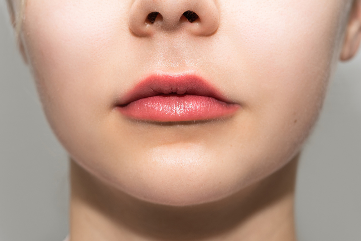 Female Lips after Permanent Makeup Lip Blushing Procedure